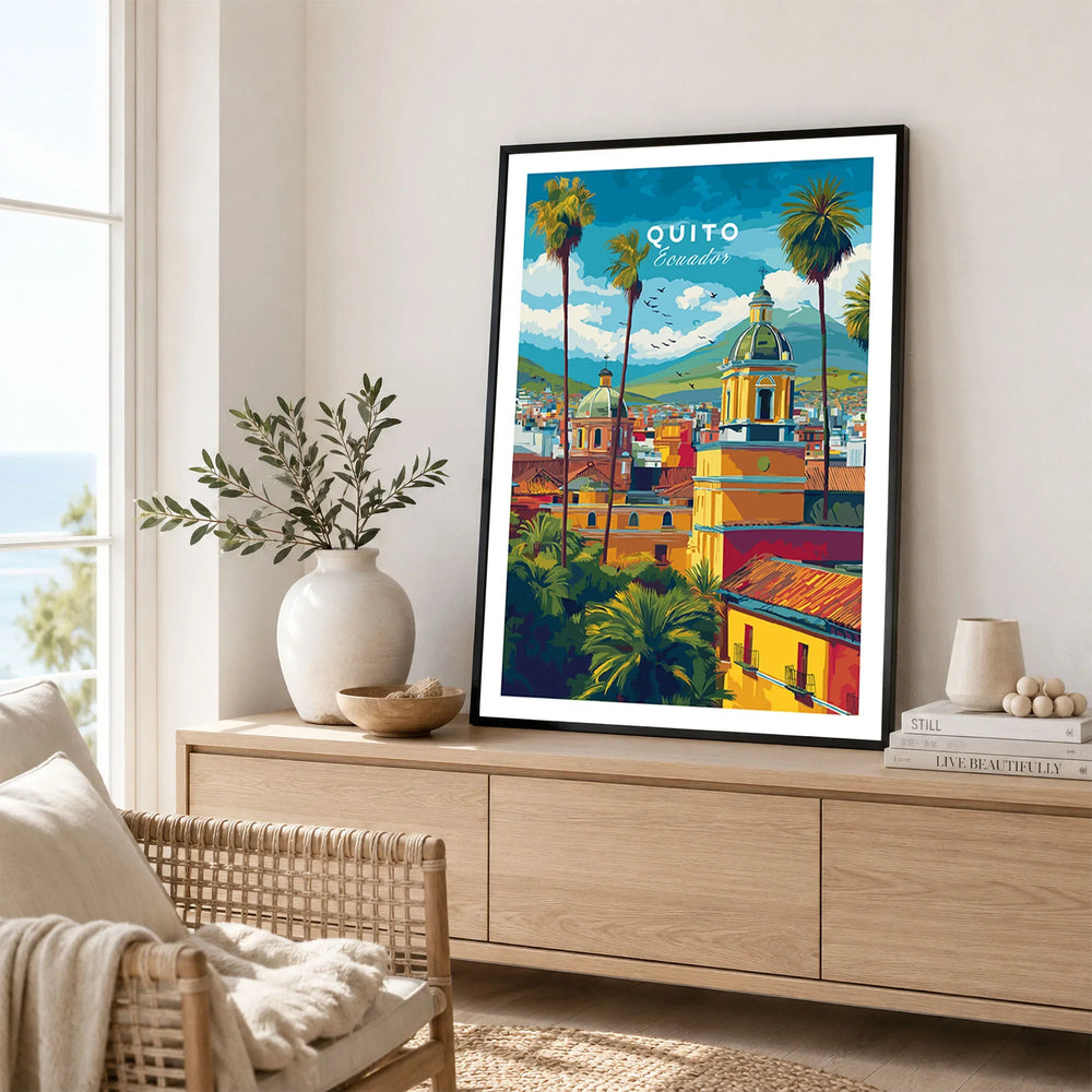 Quito Ecuador Travel Poster Cityscape Print Churches Palm Trees Andes Wall Art Decor in a black frame displayed on an oak sideboard in a bright coastal living room