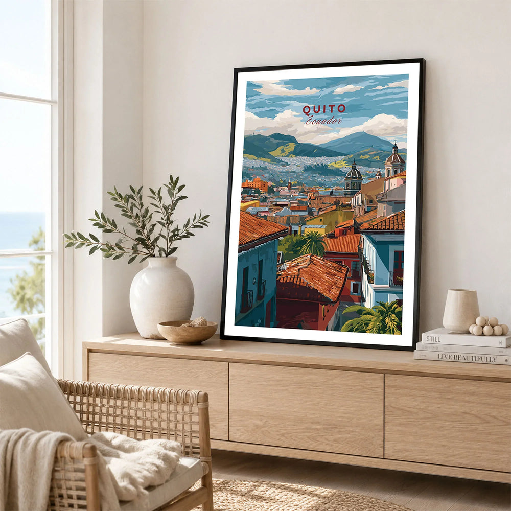 Quito Ecuador Travel Print Rooftop View Poster Cityscape Andes Hills Wall Art Decor in a black frame displayed on an oak sideboard in a bright coastal living room