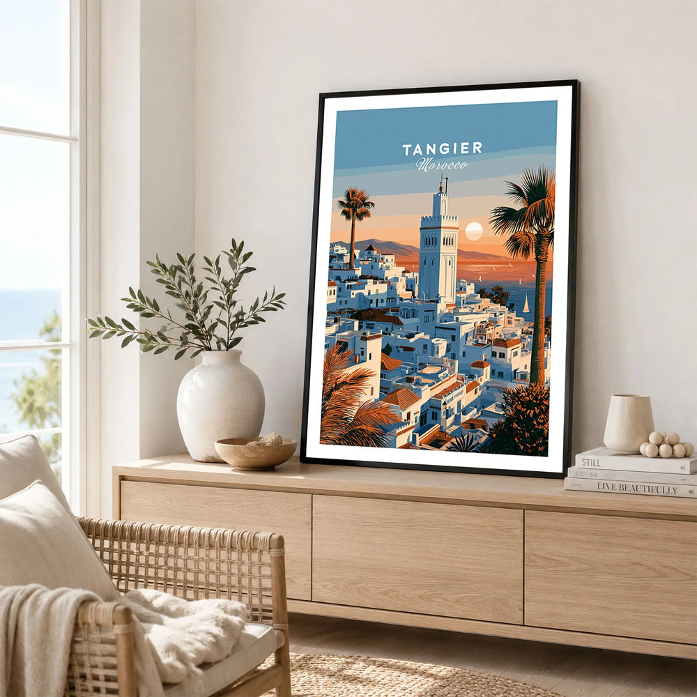 Tangier Morocco Sunset Medina Travel Poster — Tangier medina rooftops and a minaret above a bay dotted with sails, shown as framed artwork living room lifestyle setting