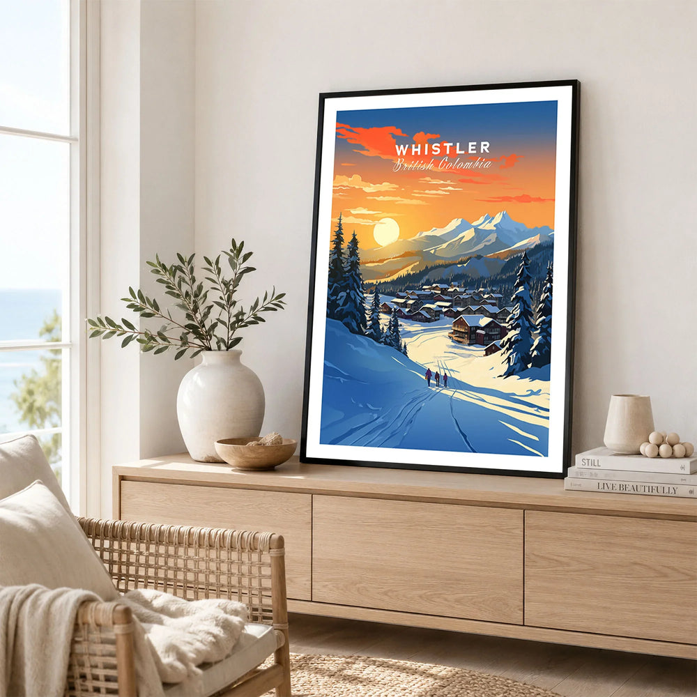 Whistler Wall Art Ski Print in a black frame displayed on an oak sideboard in a bright coastal living room