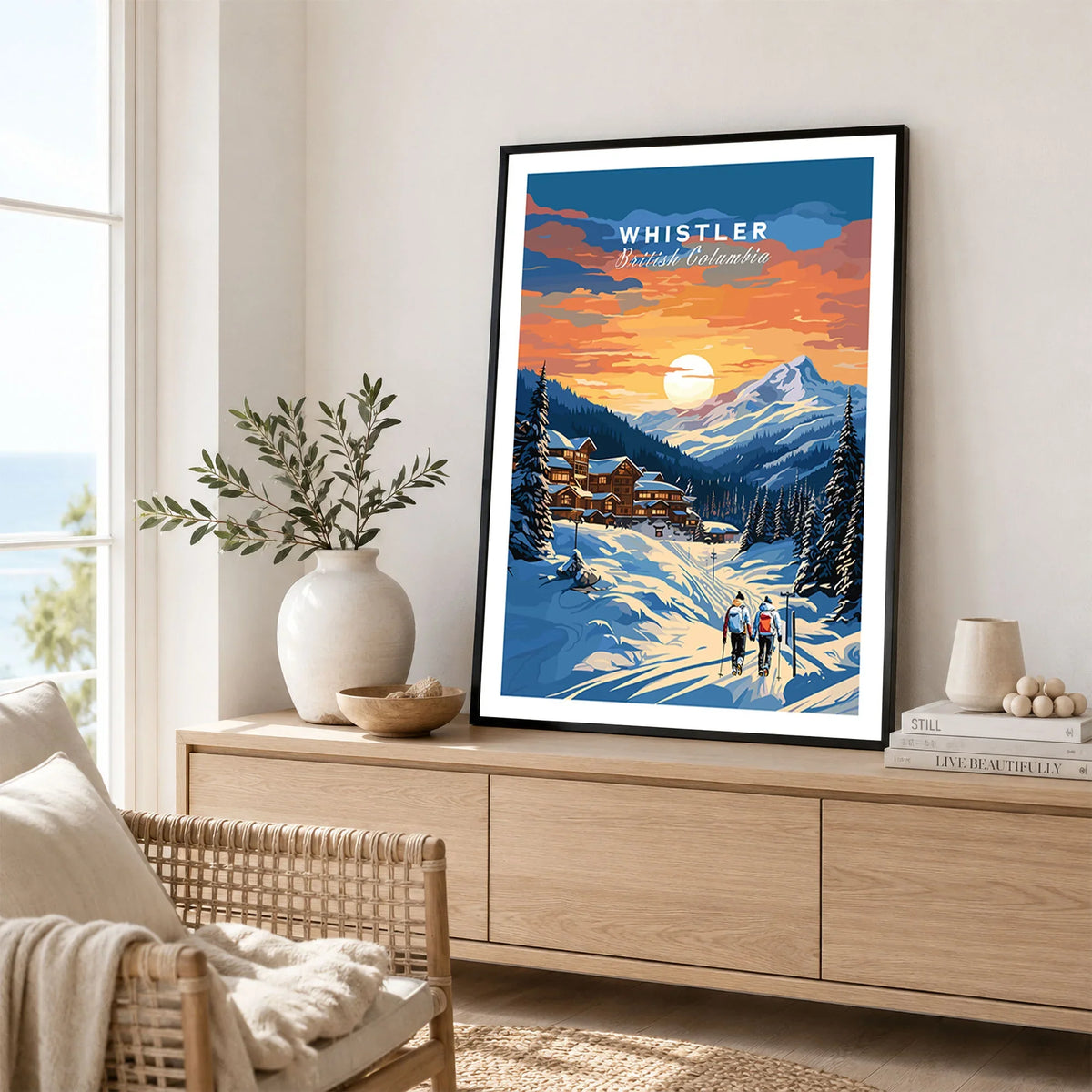 Whistler Poster in a black frame displayed on an oak sideboard in a bright coastal living room