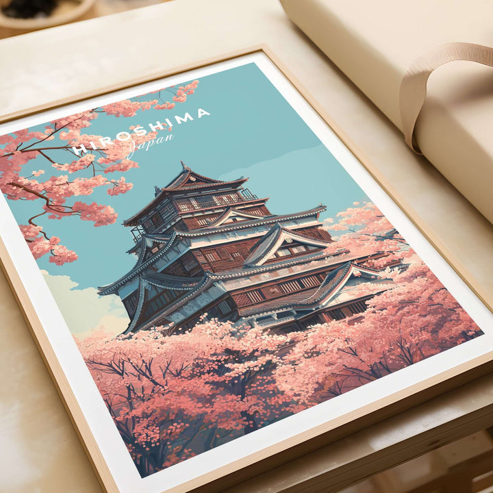 Hiroshima poster featuring cherry blossoms and a Japanese castle, celebrating springtime beauty.