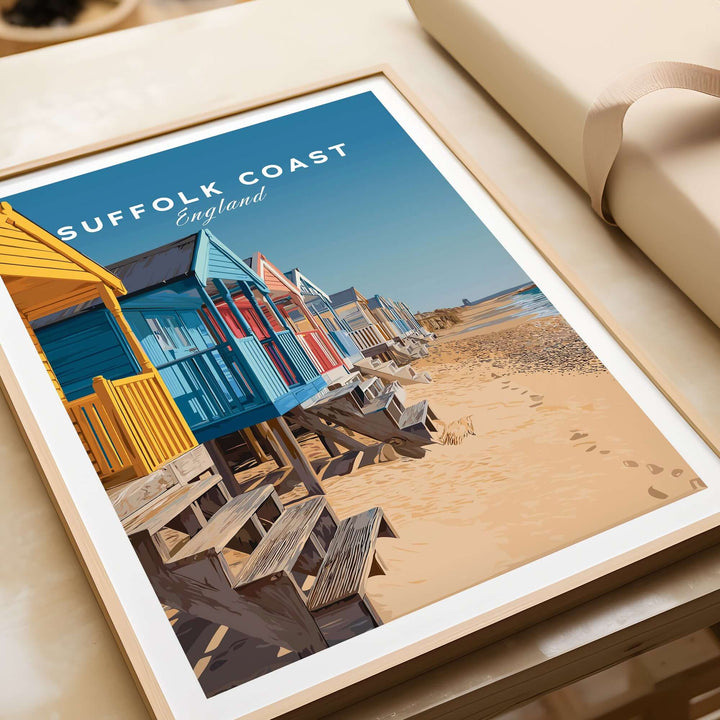 Colorful beach huts on the Suffolk Coast, England, featuring vibrant seaside art print for home decor.