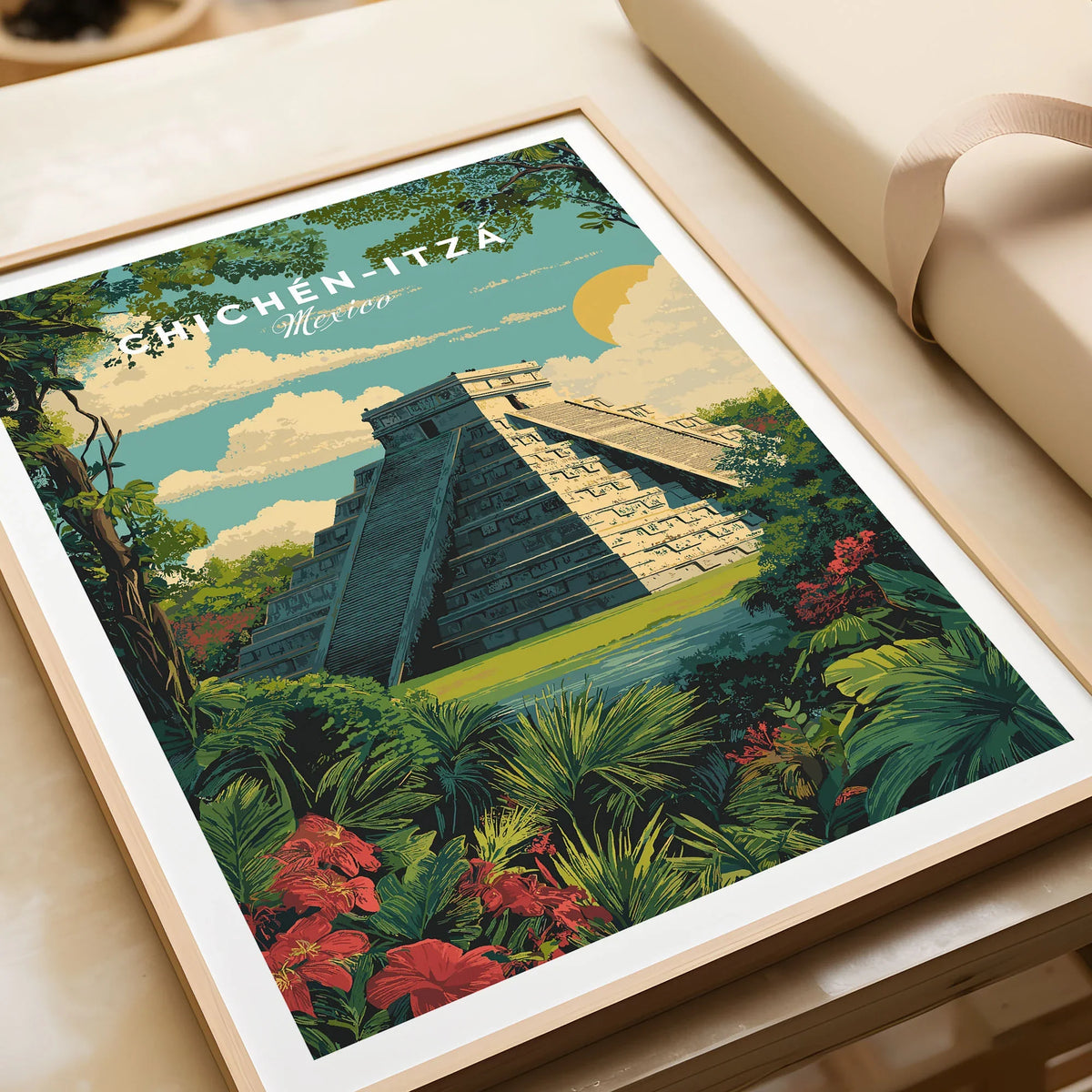 Chichén Itzá Mexico Travel Poster Pyramid Jungle Print Mayan Ruins Wall Art Decor in a natural wood frame beside wrapped gift packaging, close-up detail