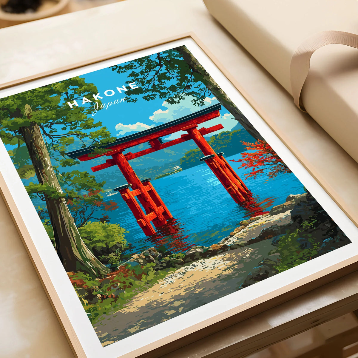 Hakone Japan Lake Ashi Torii Gate Poster - Floating Gate Wall Art in a natural wood frame beside wrapped gift packaging, close-up detail