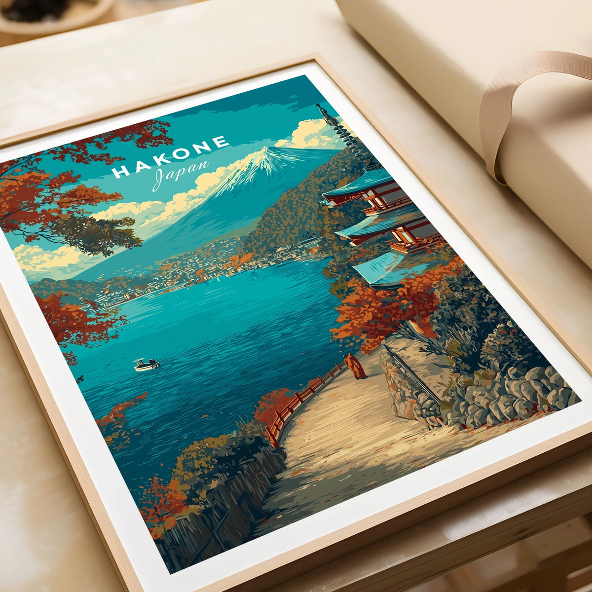 Hakone Print Japan Lake View Pagoda - Mount Fuji Scenic Poster in a natural wood frame beside wrapped gift packaging, close-up detail