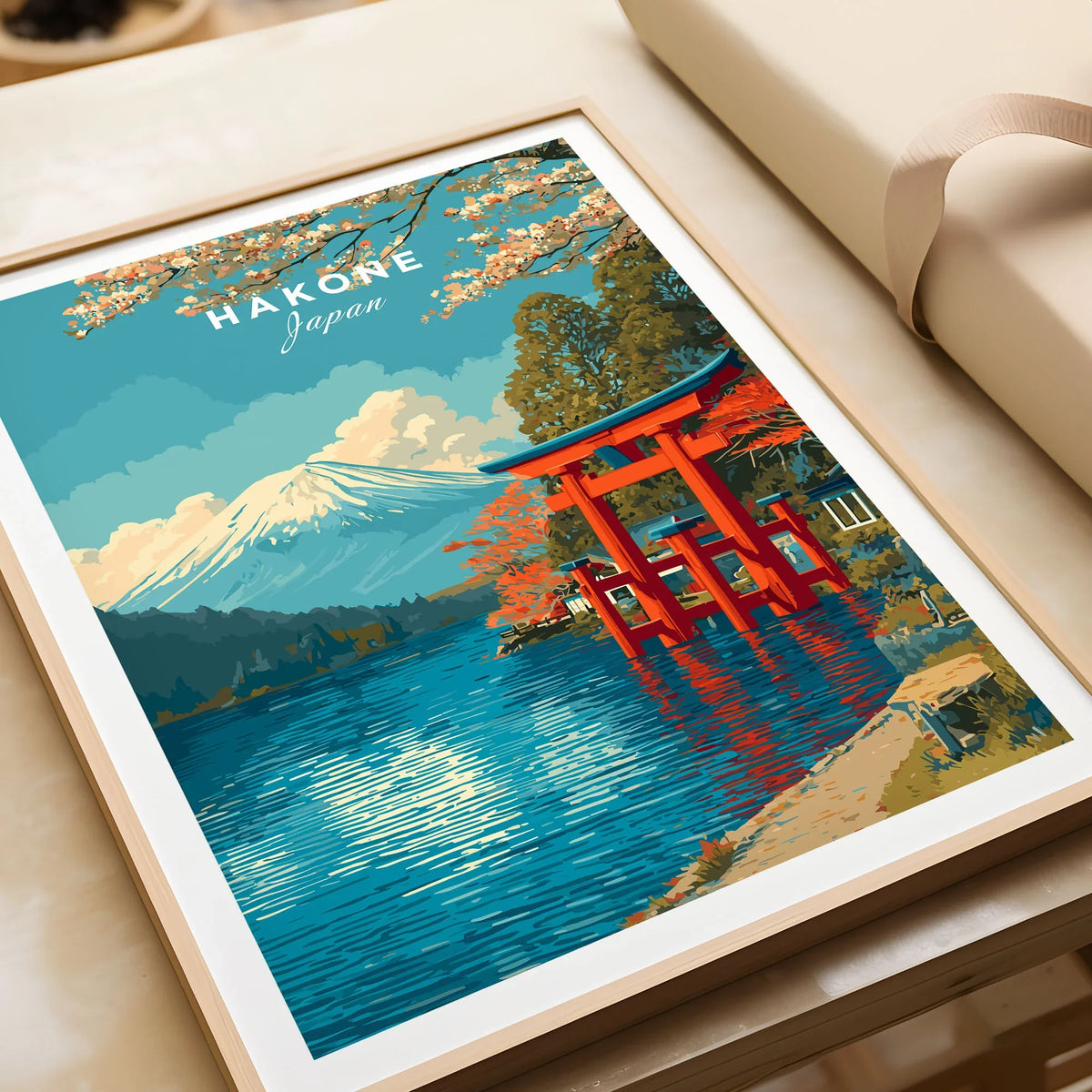 HakonePrint Japan Peace Shrine Torii Artwork - Mount Fuji Lake Ashi Poster in a natural wood frame beside wrapped gift packaging, close-up detail
