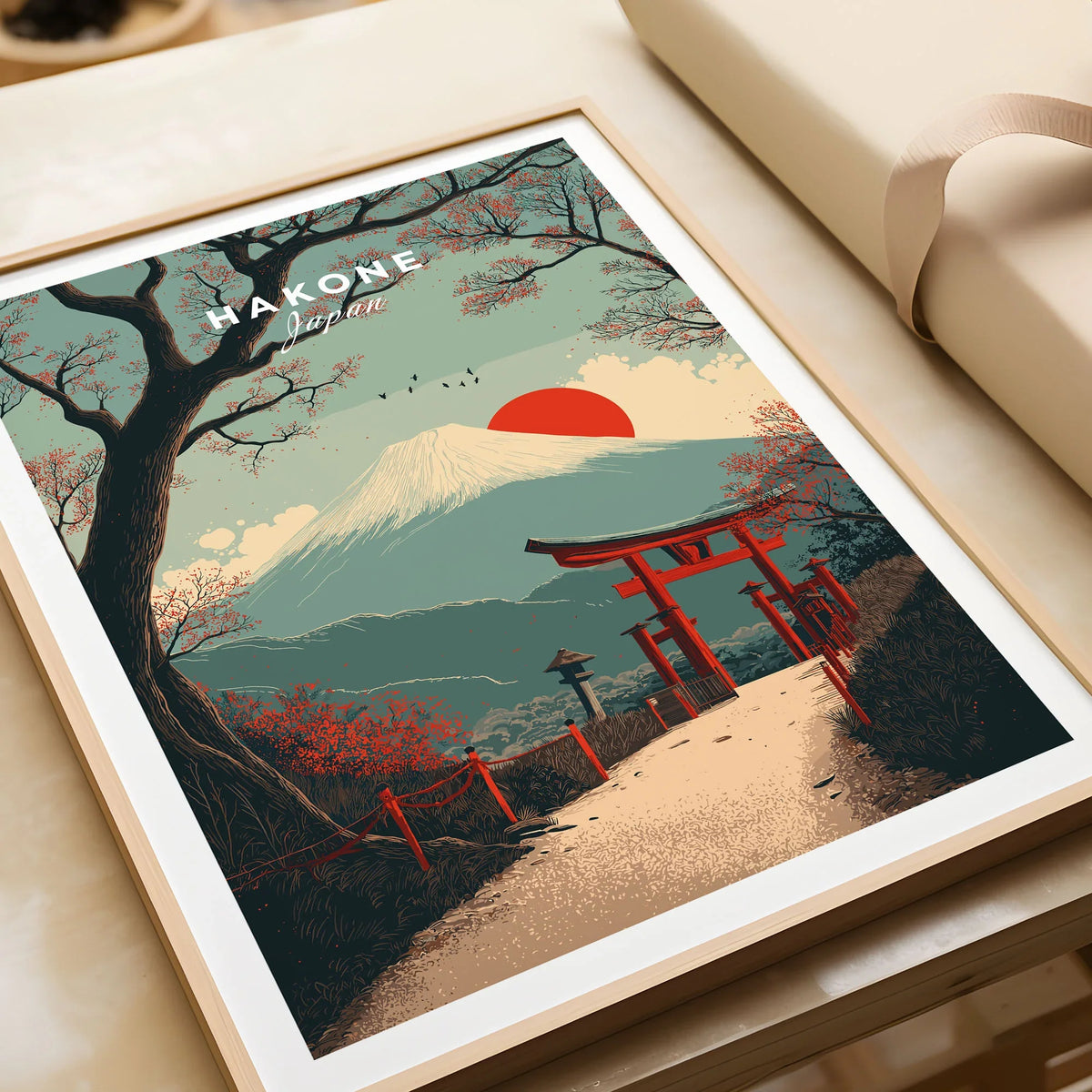 Hakone Japan Torii Gate Mount Fuji Print - Iconic Japanese Poster in a natural wood frame beside wrapped gift packaging, close-up detail
