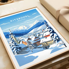 Kitzbuhel Poster in a natural wood frame beside wrapped gift packaging, close-up detail