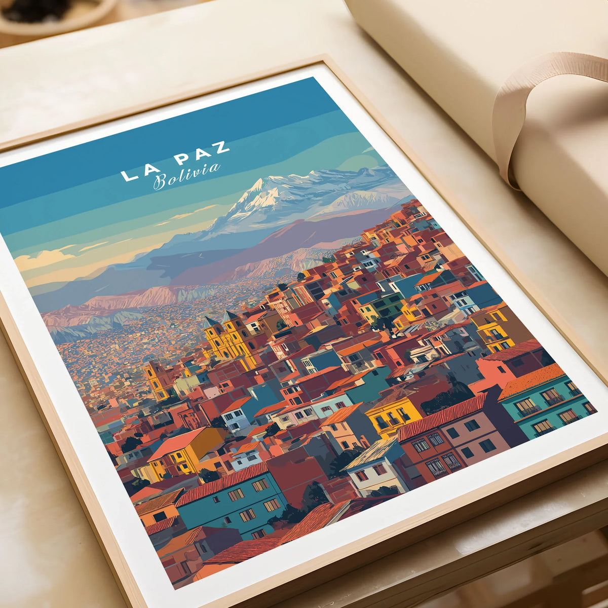 La Paz Bolivia Andes Mountain City Print - Travel Poster in a natural wood frame beside wrapped gift packaging, close-up detail