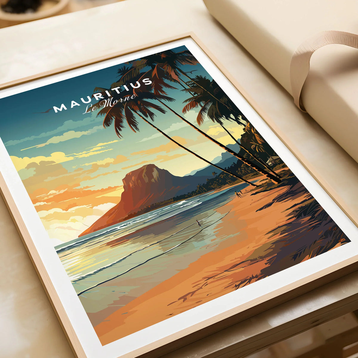 Mauritius Le Morne Poster in a natural wood frame beside wrapped gift packaging, close-up detail