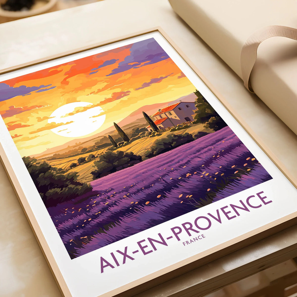 Aix-en-Provence Art Print in a natural wood frame beside wrapped gift packaging, close-up detail