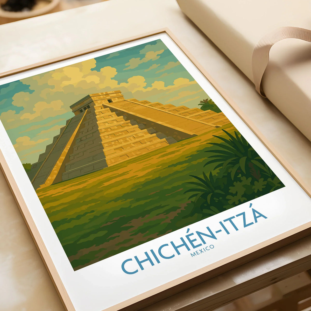 Mexico Mayan Pyramid Chichén Itzá Travel Poster El Castillo Landscape Print Wall Art in a natural wood frame beside wrapped gift packaging, close-up detail
