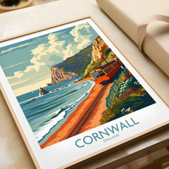 Cornwall Coast Wall Art Print in a natural wood frame beside wrapped gift packaging, close-up detail
