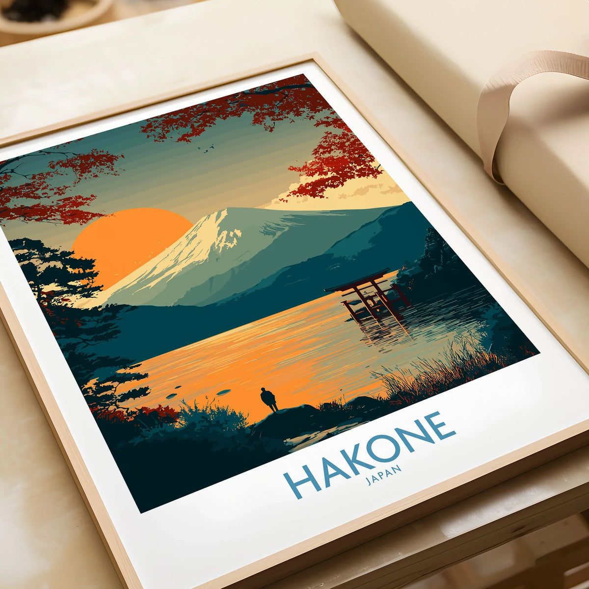 Hakone Japan Wall Art Lake Ashi Print - Japanese Spiritual Poster in a natural wood frame beside wrapped gift packaging, close-up detail