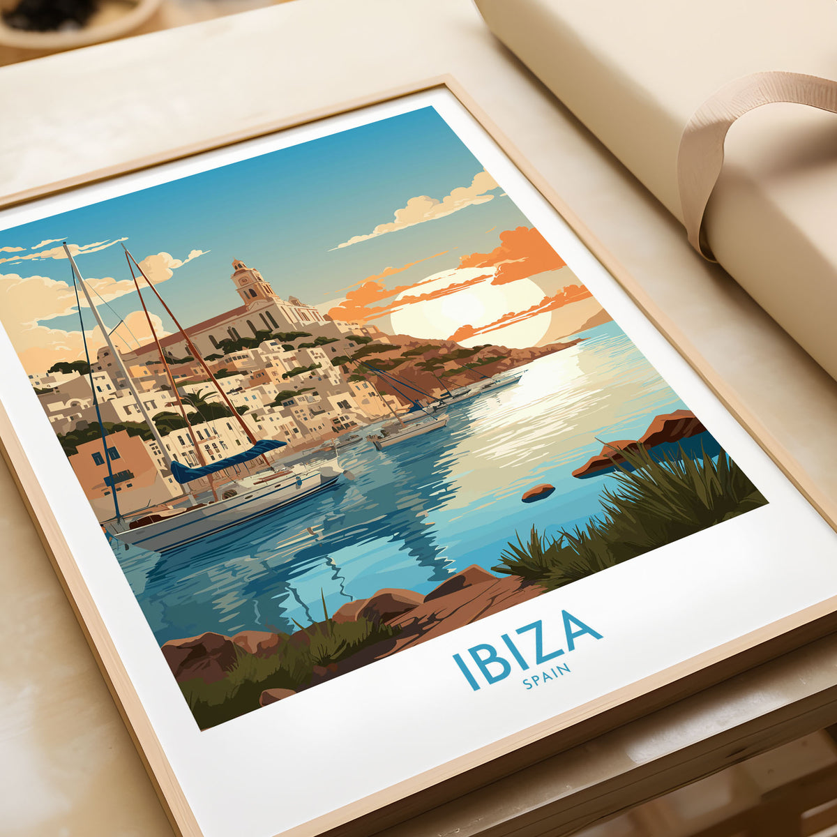 Ibiza Poster Print Modern in a natural wood frame beside wrapped gift packaging, close-up detail