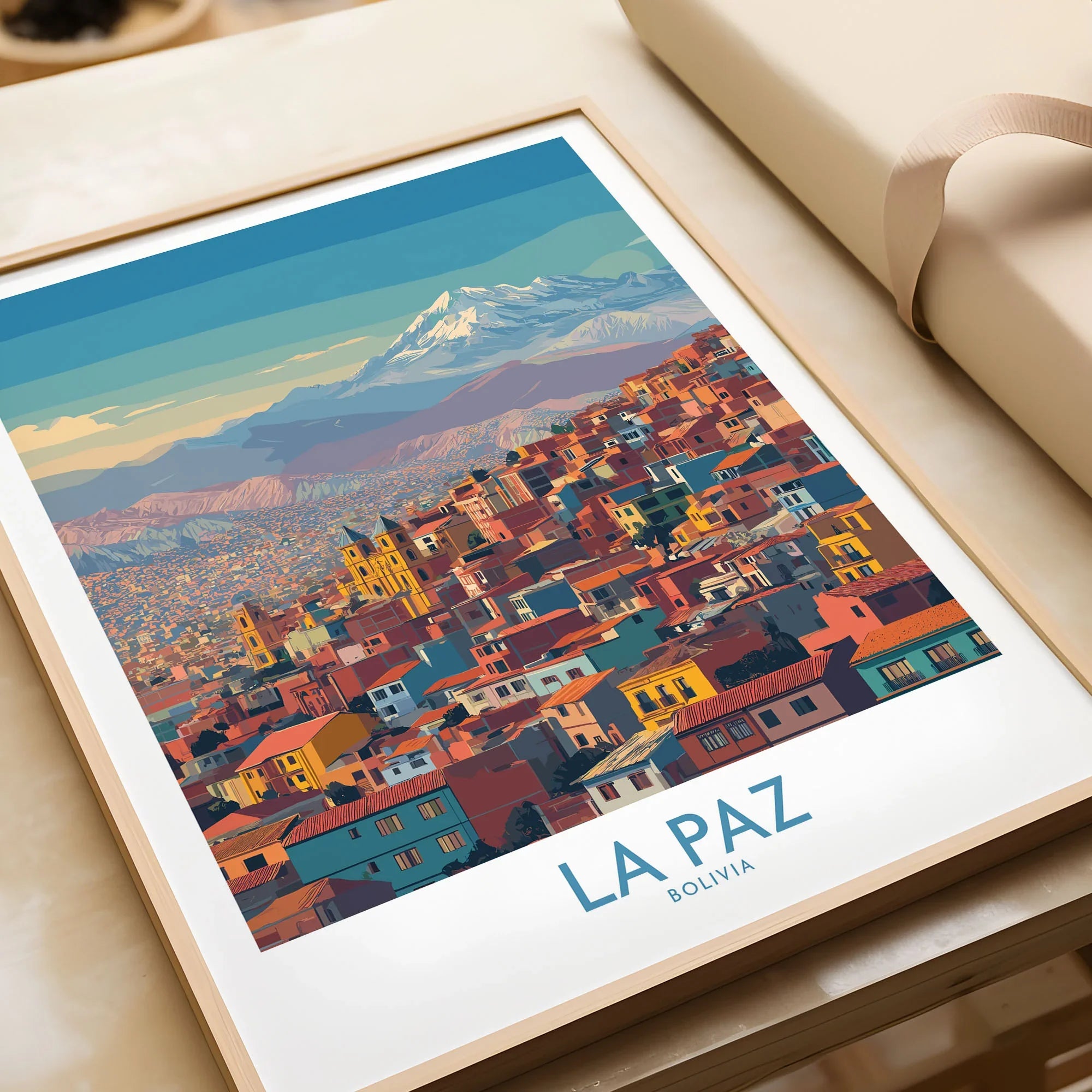 La Paz Bolivia Urban Landscape Wall Art - South American City Print in a natural wood frame beside wrapped gift packaging, close-up detail