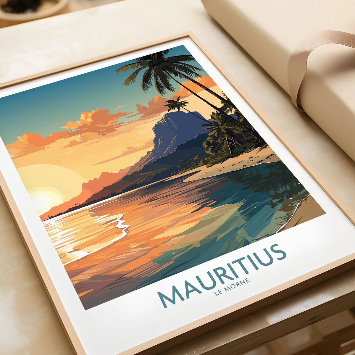 Le Morne Mauritius Wall Art in a natural wood frame beside wrapped gift packaging, close-up detail