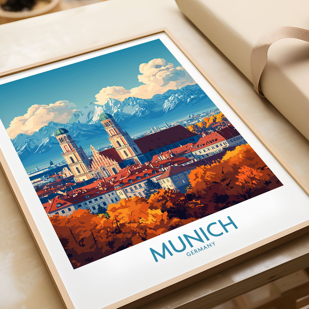 Munich Travel Poster in a natural wood frame beside wrapped gift packaging, close-up detail