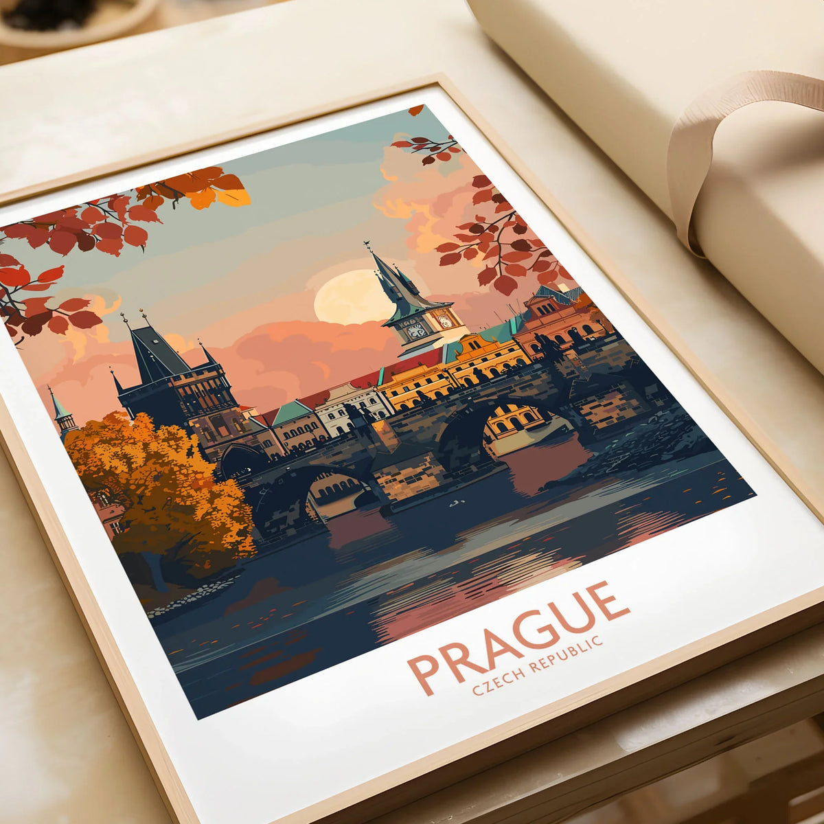 Prague Travel Print in a natural wood frame beside wrapped gift packaging, close-up detail