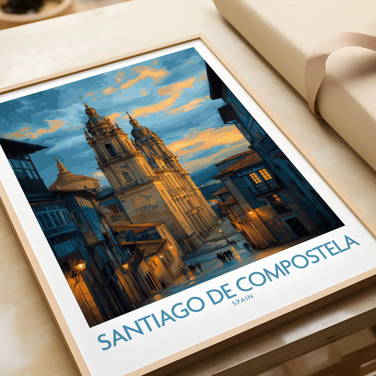 Santiago de Compostela Cathedral Art Print | Cityscape Poster in a natural wood frame beside wrapped gift packaging, close-up detail