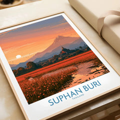 Suphan Buri Thailand Temple Sunset Wall Art — a lotus-covered lake and temple spire at sunset beneath a mountain peak, shown as framed art print closeup gift unwrapped natural frame