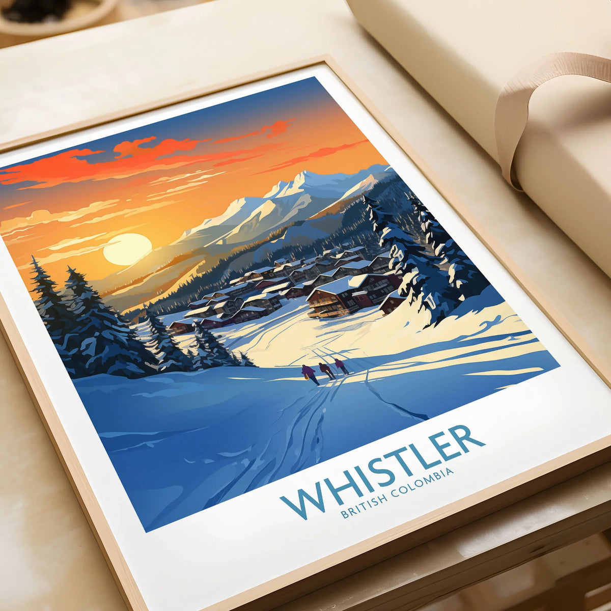Whistler Wall Art Ski Poster in a natural wood frame beside wrapped gift packaging, close-up detail