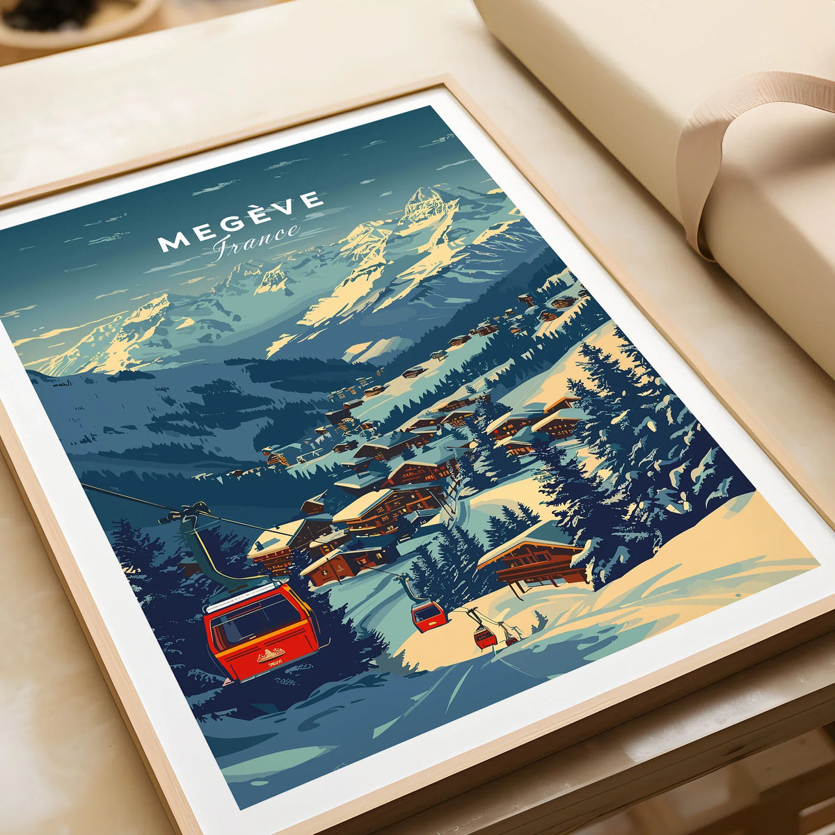 Megève Print France Ski Poster in a natural wood frame beside wrapped gift packaging, close-up detail