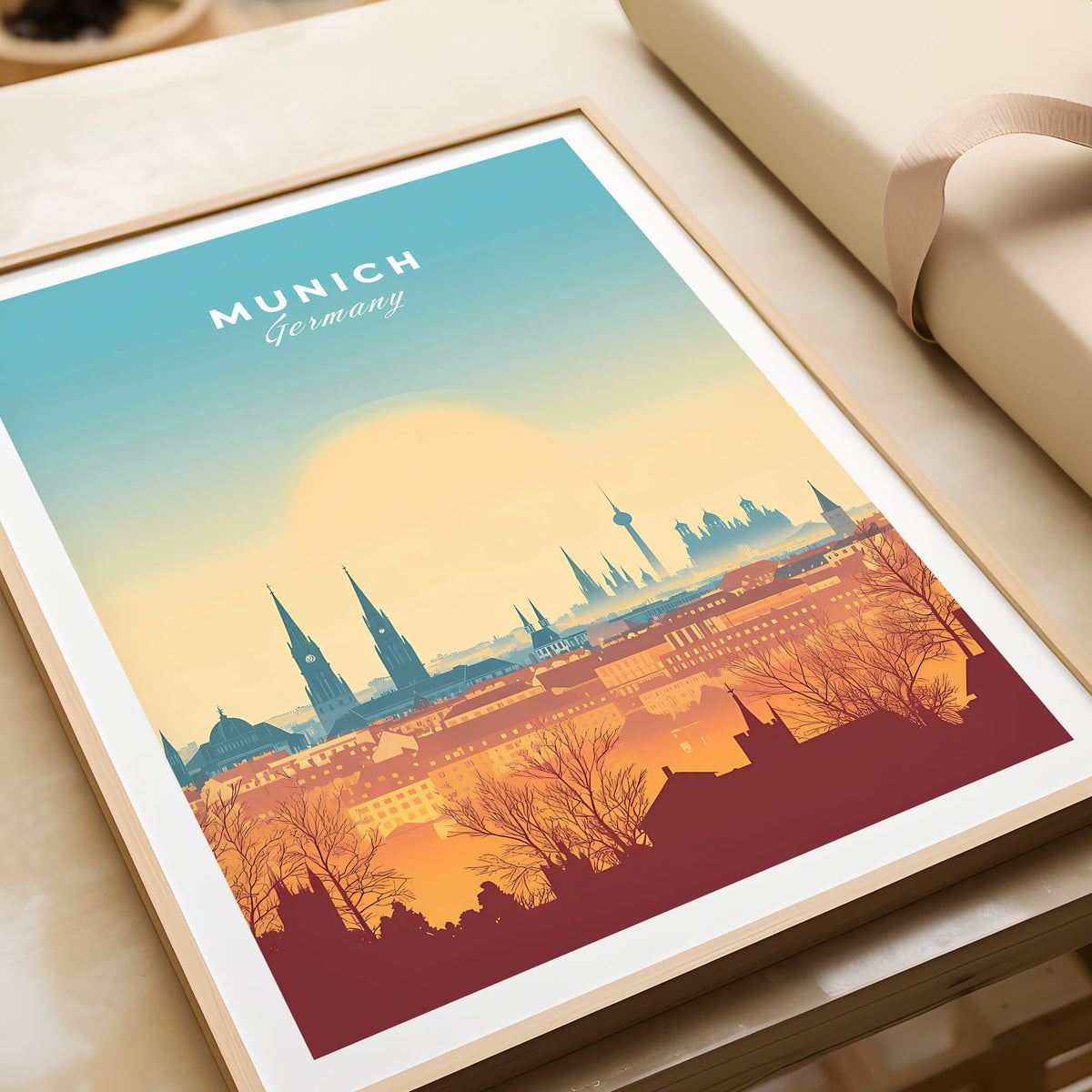 Munich Wall Art in a natural wood frame beside wrapped gift packaging, close-up detail