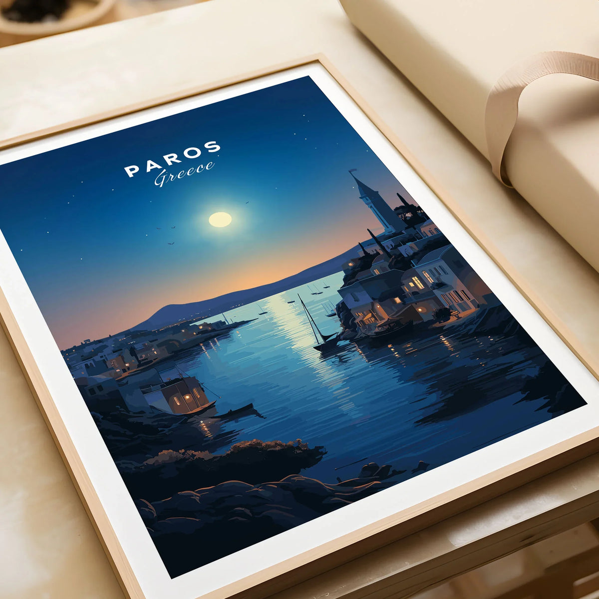 Paros Greece Print in a natural wood frame beside wrapped gift packaging, close-up detail