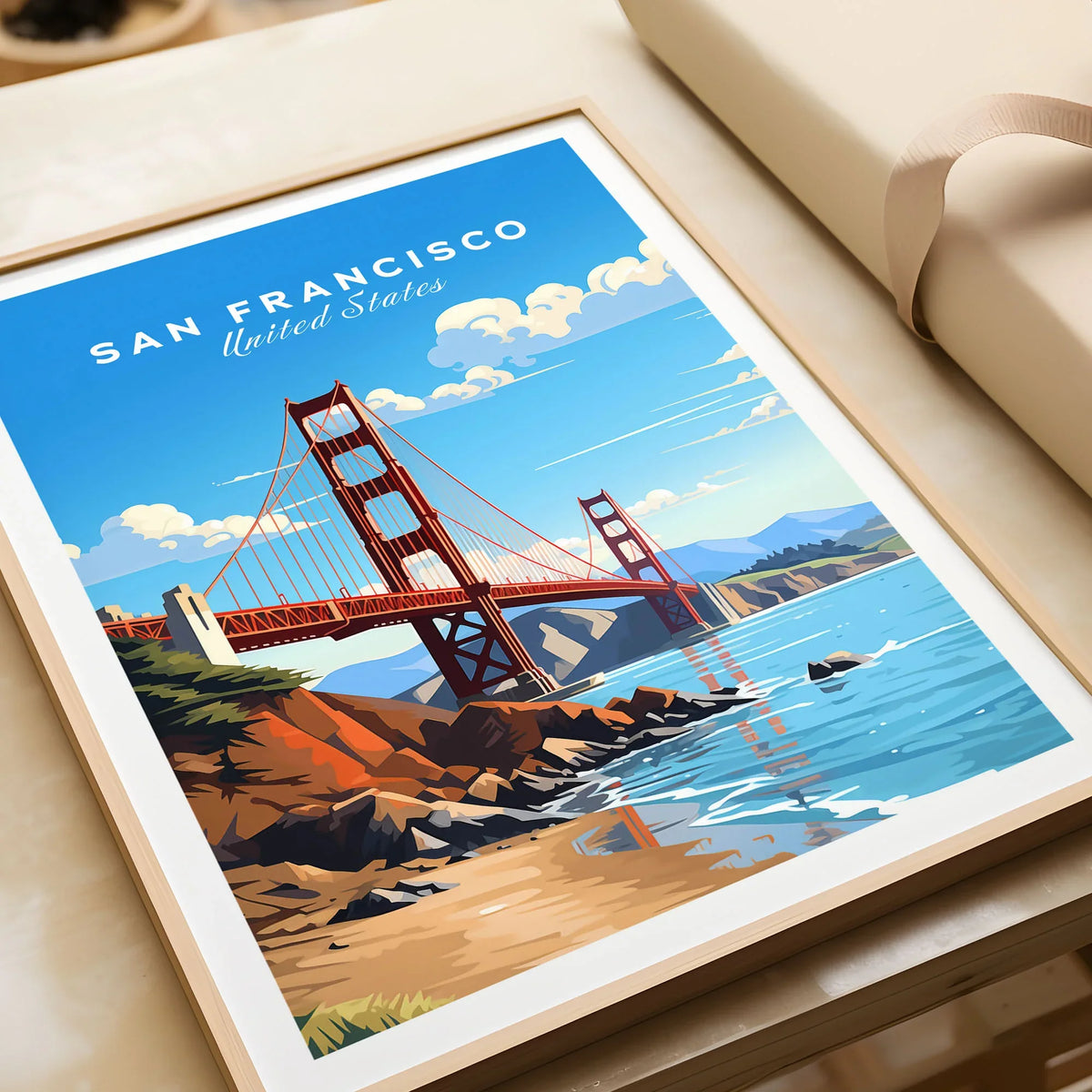 San Francisco Print in a natural wood frame beside wrapped gift packaging, close-up detail