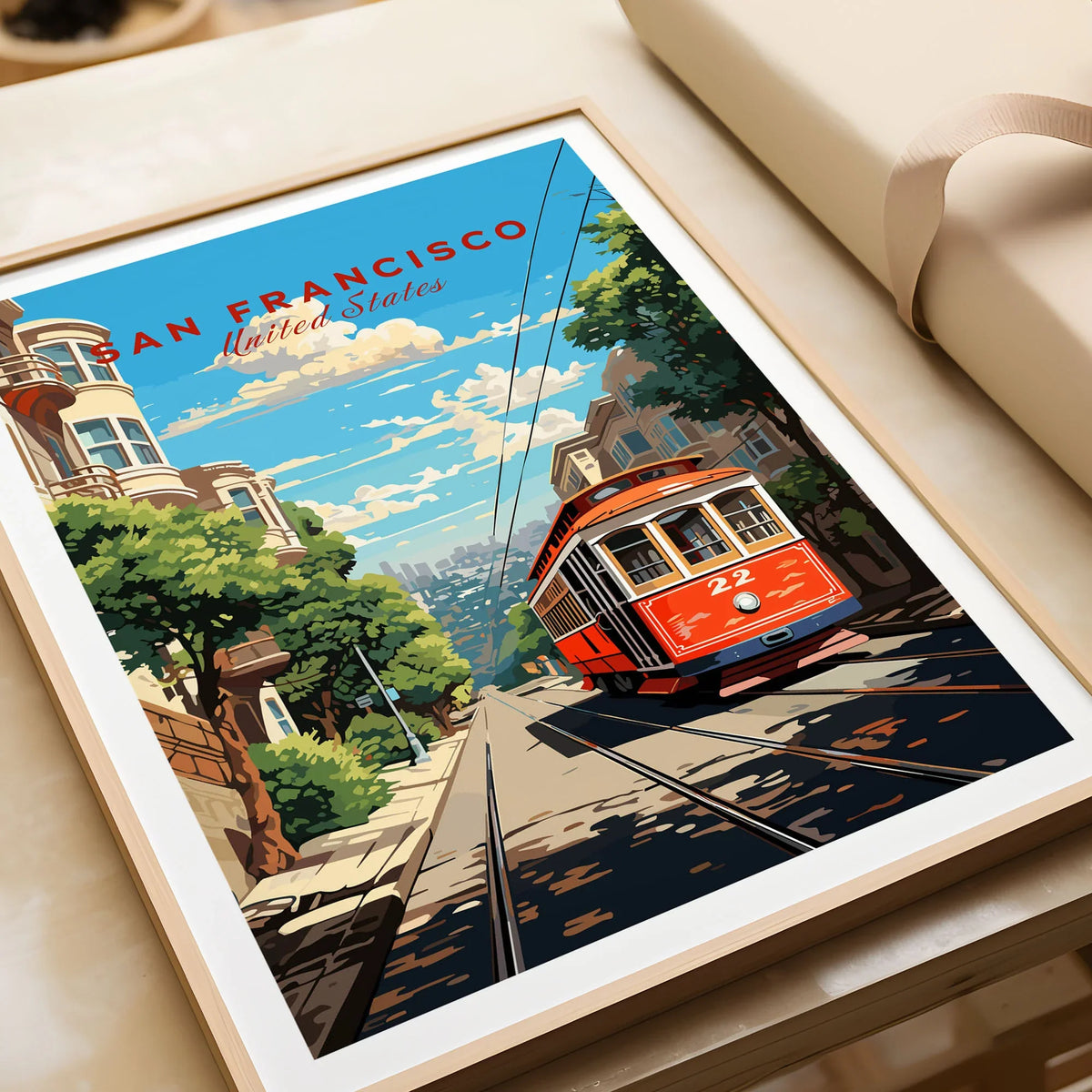 San Francisco Wall Art in a natural wood frame beside wrapped gift packaging, close-up detail