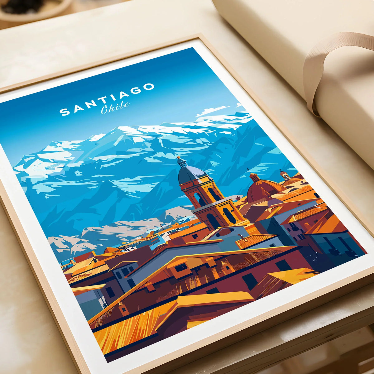 Santiago Travel Print - Chile Poster in a natural wood frame beside wrapped gift packaging, close-up detail