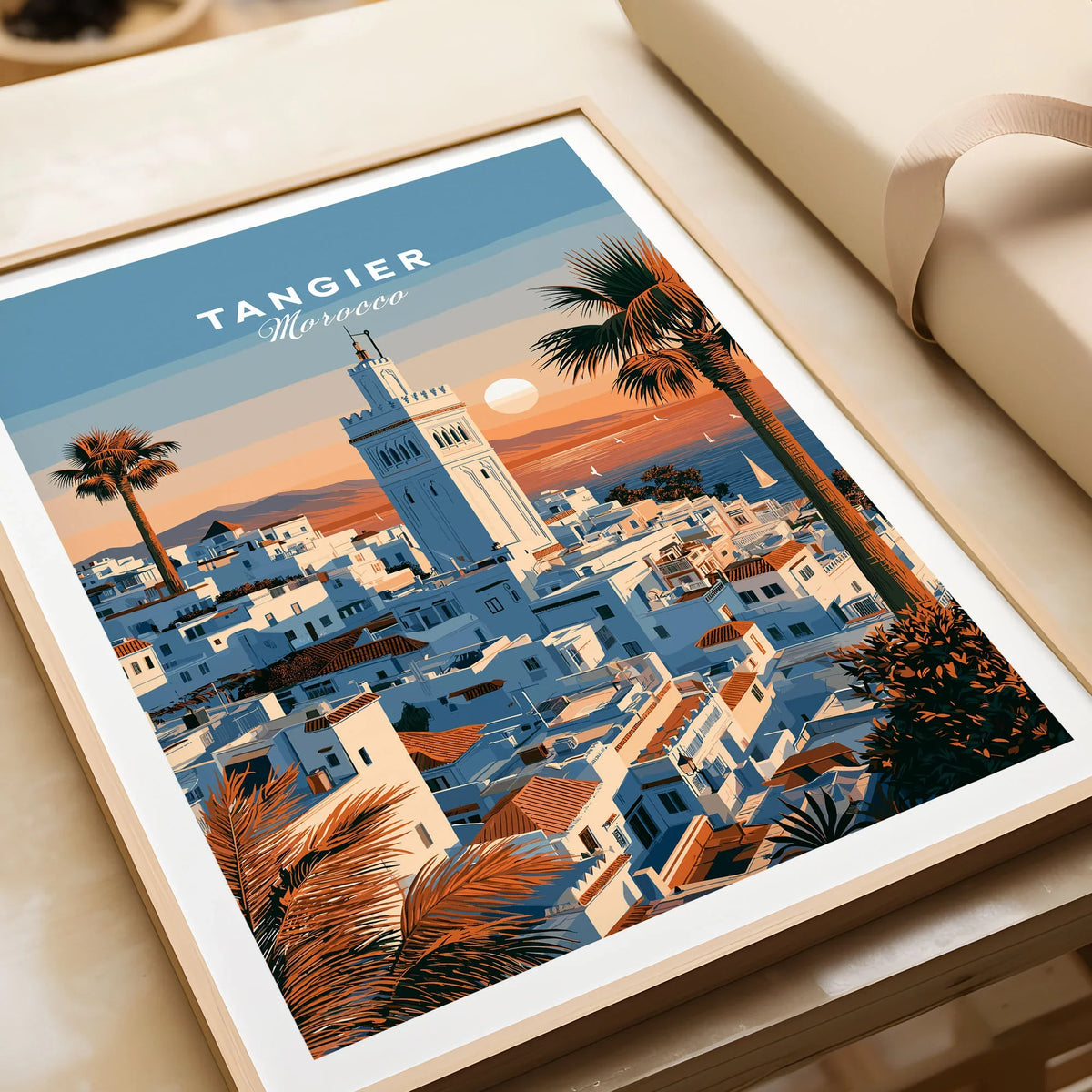 Tangier Morocco Sunset Medina Travel Poster — Tangier medina rooftops and a minaret above a bay dotted with sails, shown as framed art print closeup gift unwrapped natural frame