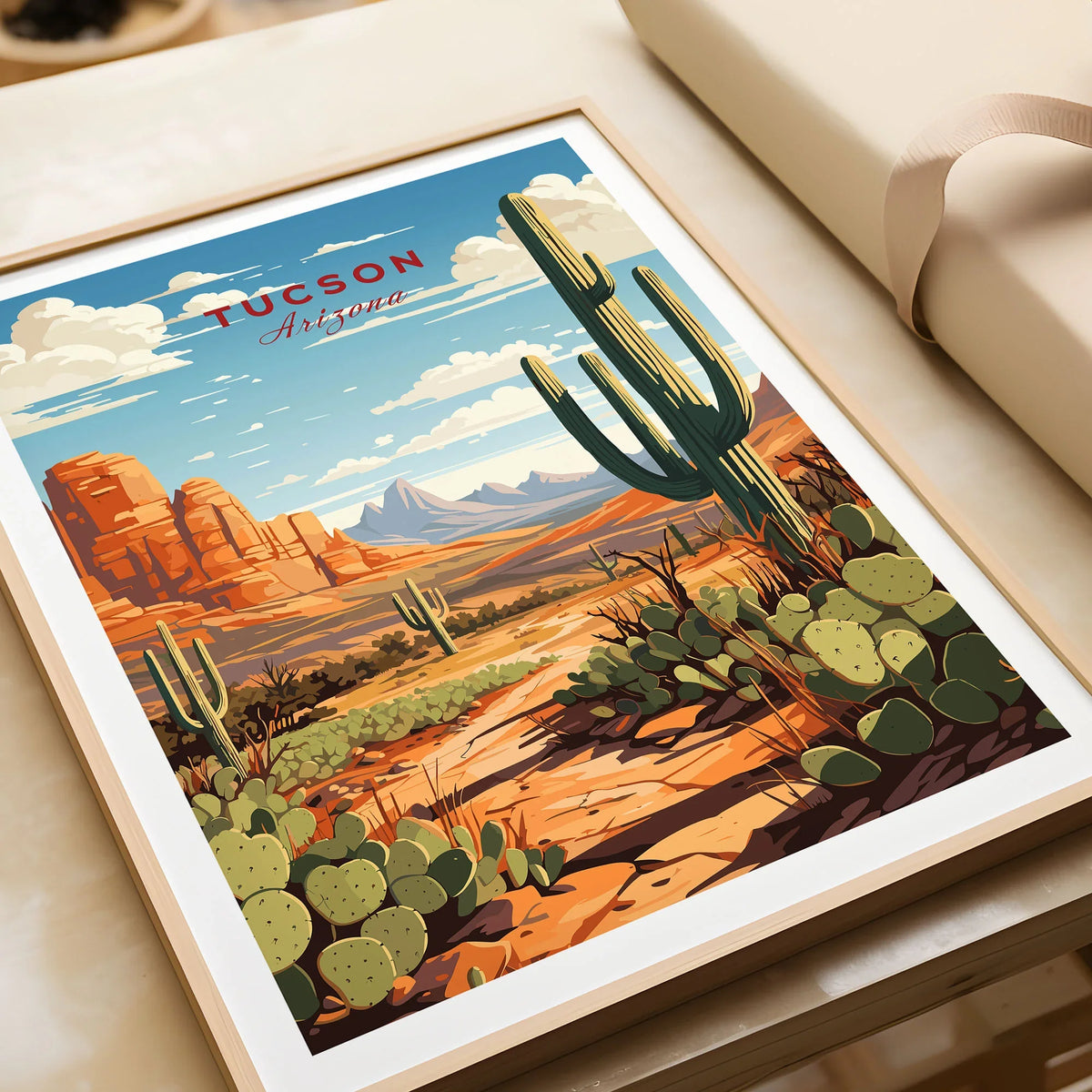 Tucson Arizona Print in a natural wood frame beside wrapped gift packaging, close-up detail