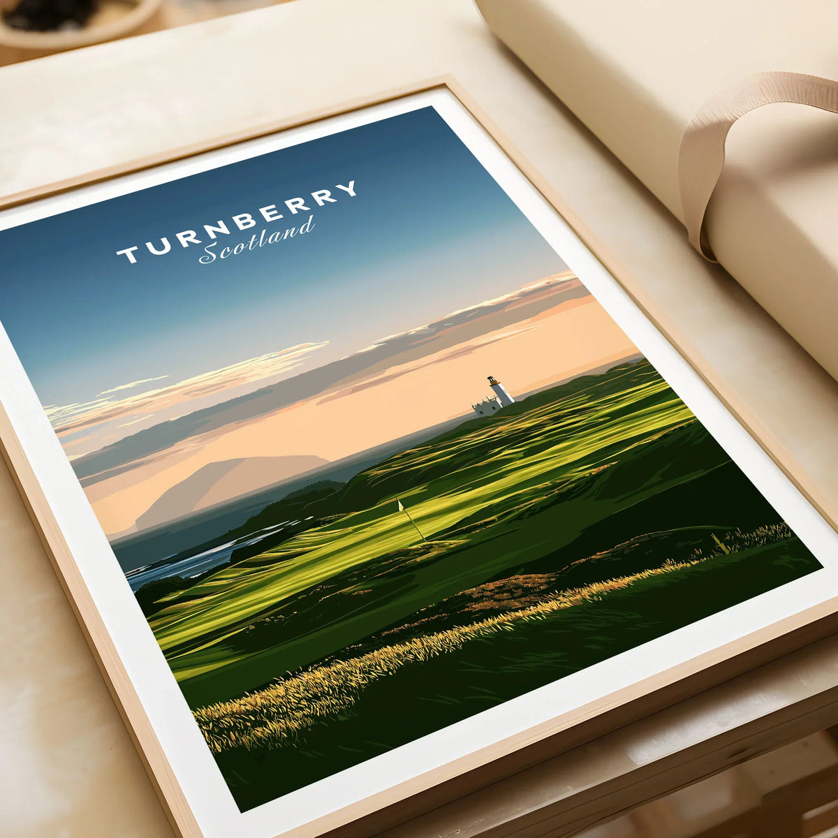 Turnberry Scotland Ailsa Craig Travel Poster — Ailsa Craig and the white lighthouse across rolling coastal turf at dusk, shown as framed art print closeup gift unwrapped natural frame