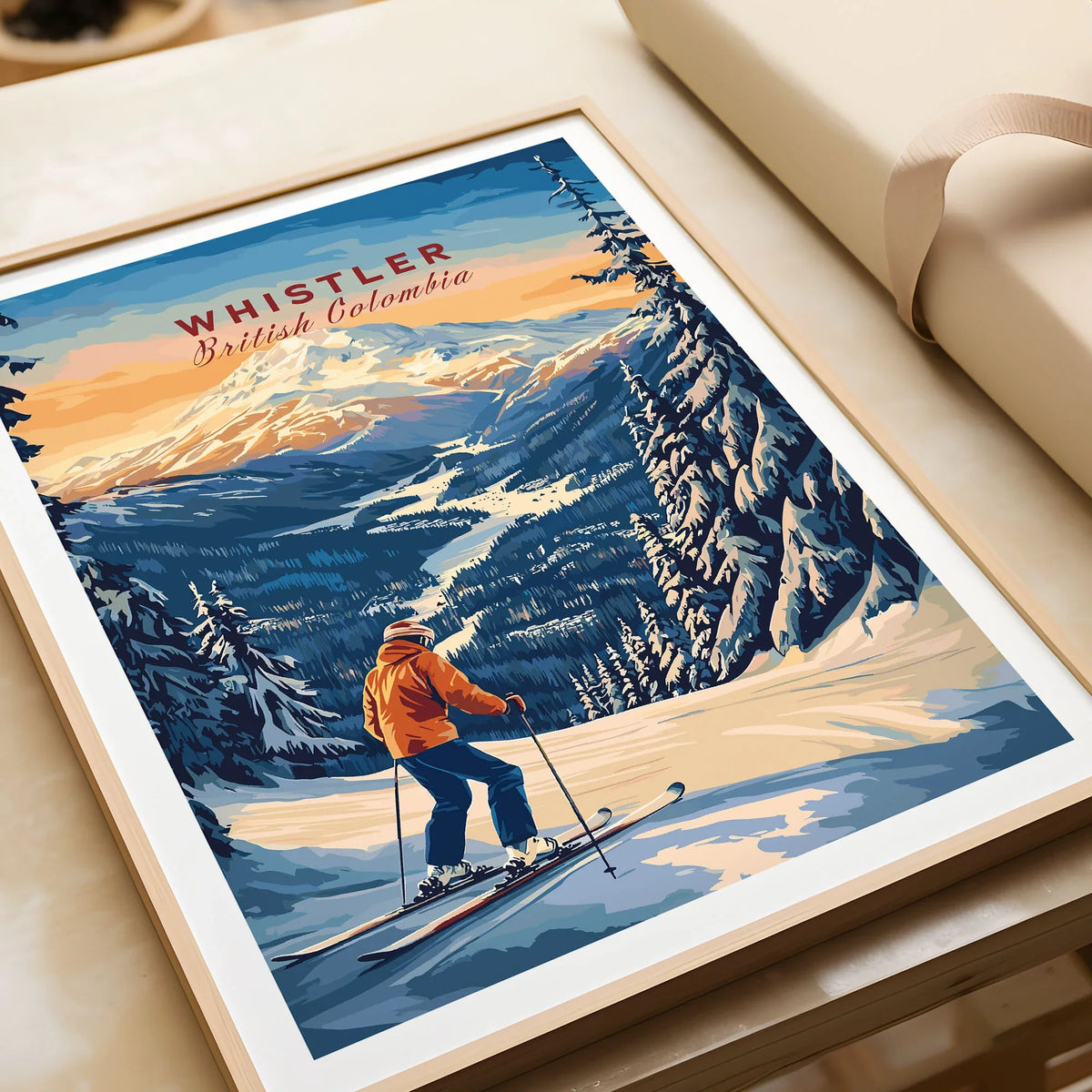 Whistler Travel Poster -  British Columbia in a natural wood frame beside wrapped gift packaging, close-up detail