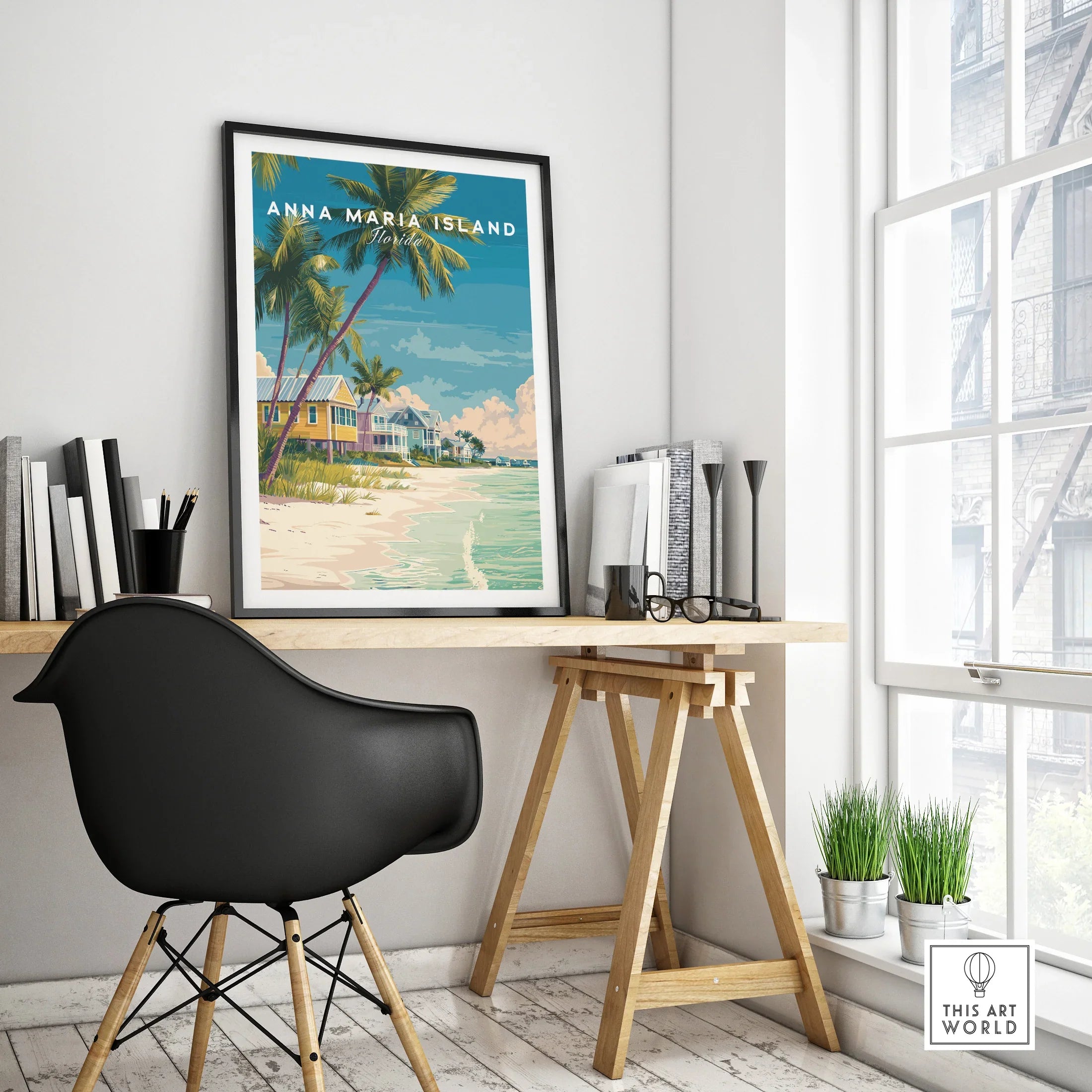Anna Maria Island travel poster with beach and palm trees in black frame on modern office desk