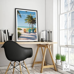 Framed Anna Maria Island travel poster on modern office desk with beach and palm art print