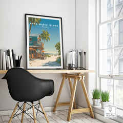 Framed Anna Maria Island travel poster with beach scene on a modern office desk