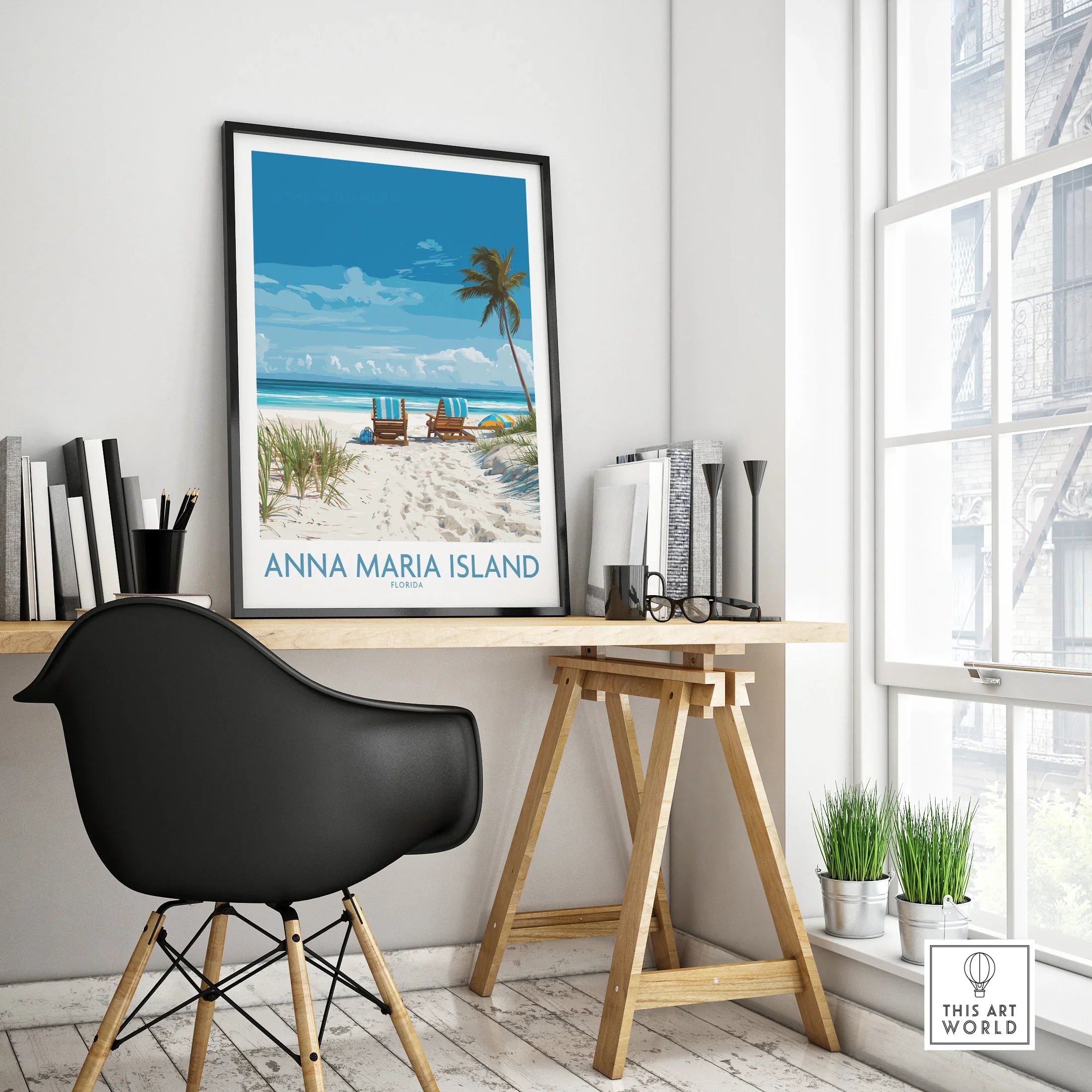 Anna Maria Island travel poster with beach scene in black frame on modern office desk