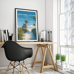 Anna Maria Island travel poster with beach scene in black frame on modern office desk