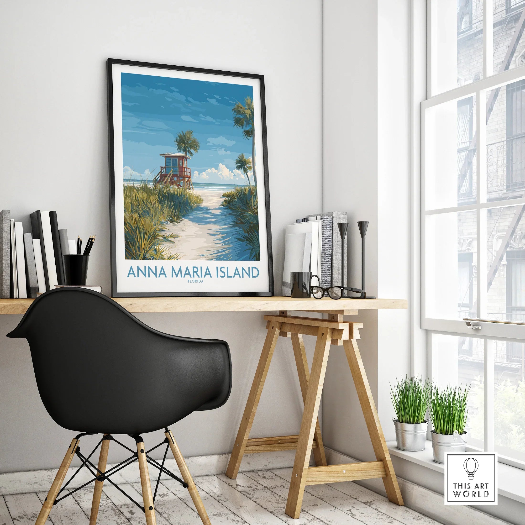 Anna Maria Island travel poster in black frame on modern office desk by window
