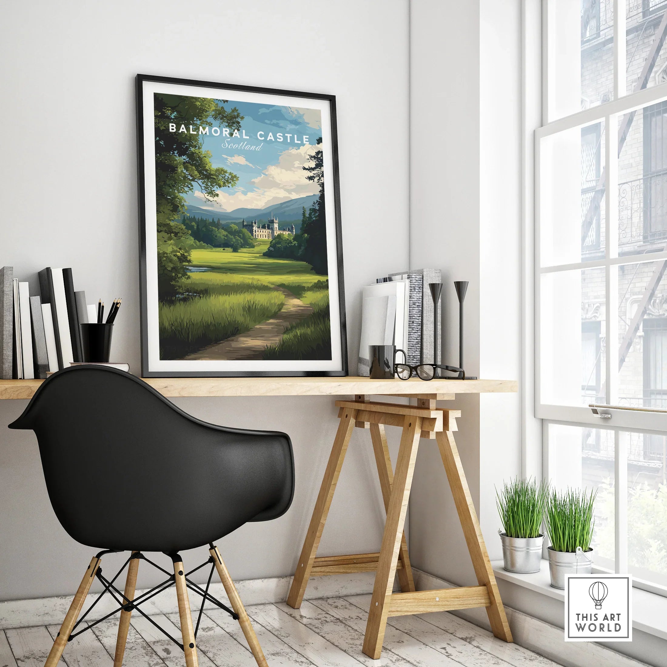 Balmoral Castle Scotland travel poster in black frame on modern office desk by window