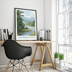 Framed Balmoral Castle travel poster on modern office desk with black chair and window