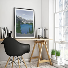 Banff National Park travel poster in black frame on modern office desk, minimalist decor