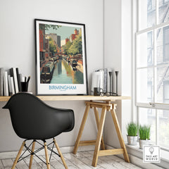 Framed Birmingham city canal travel poster on modern office desk with black chair