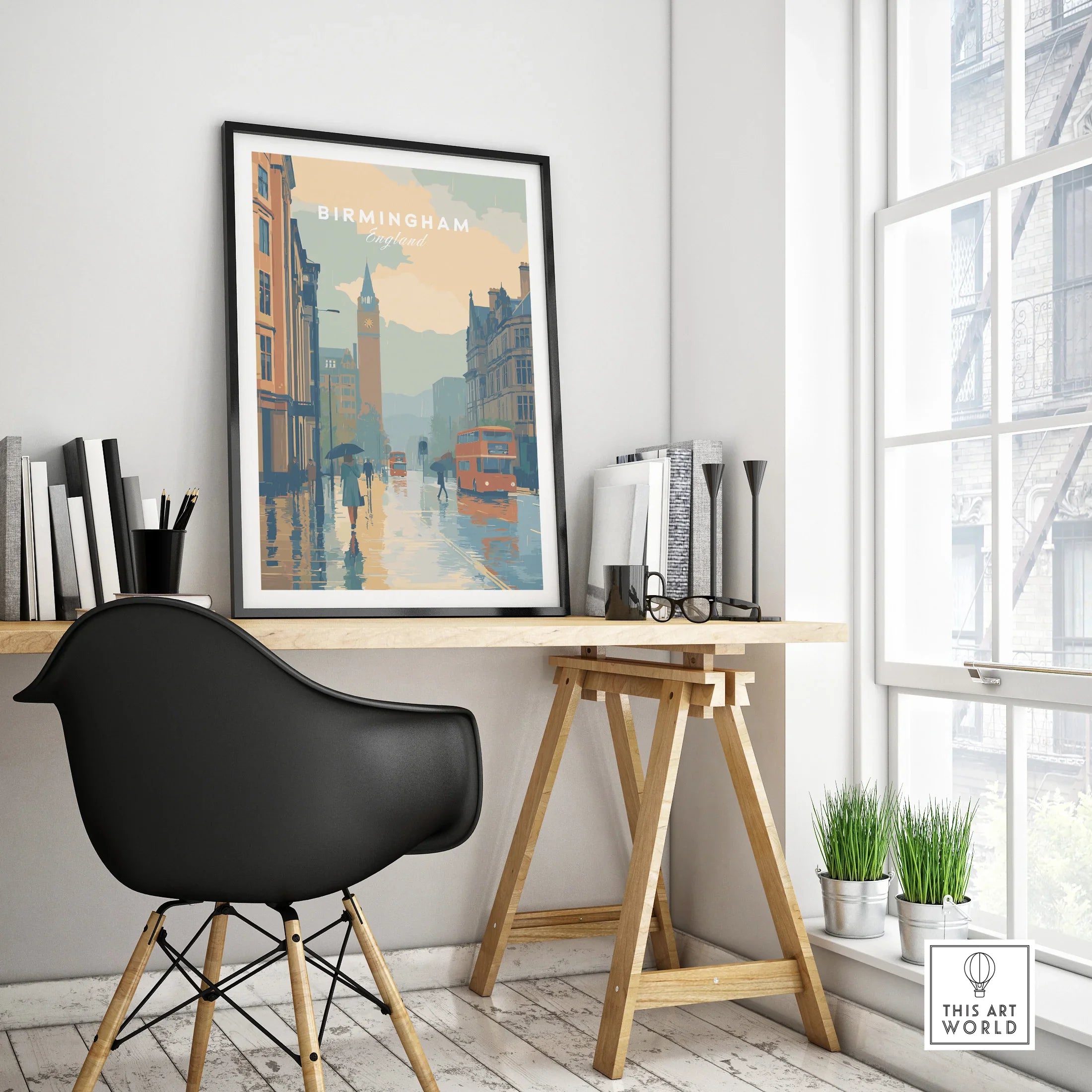 Framed Birmingham city skyline travel poster on a modern office desk, home decor setting.