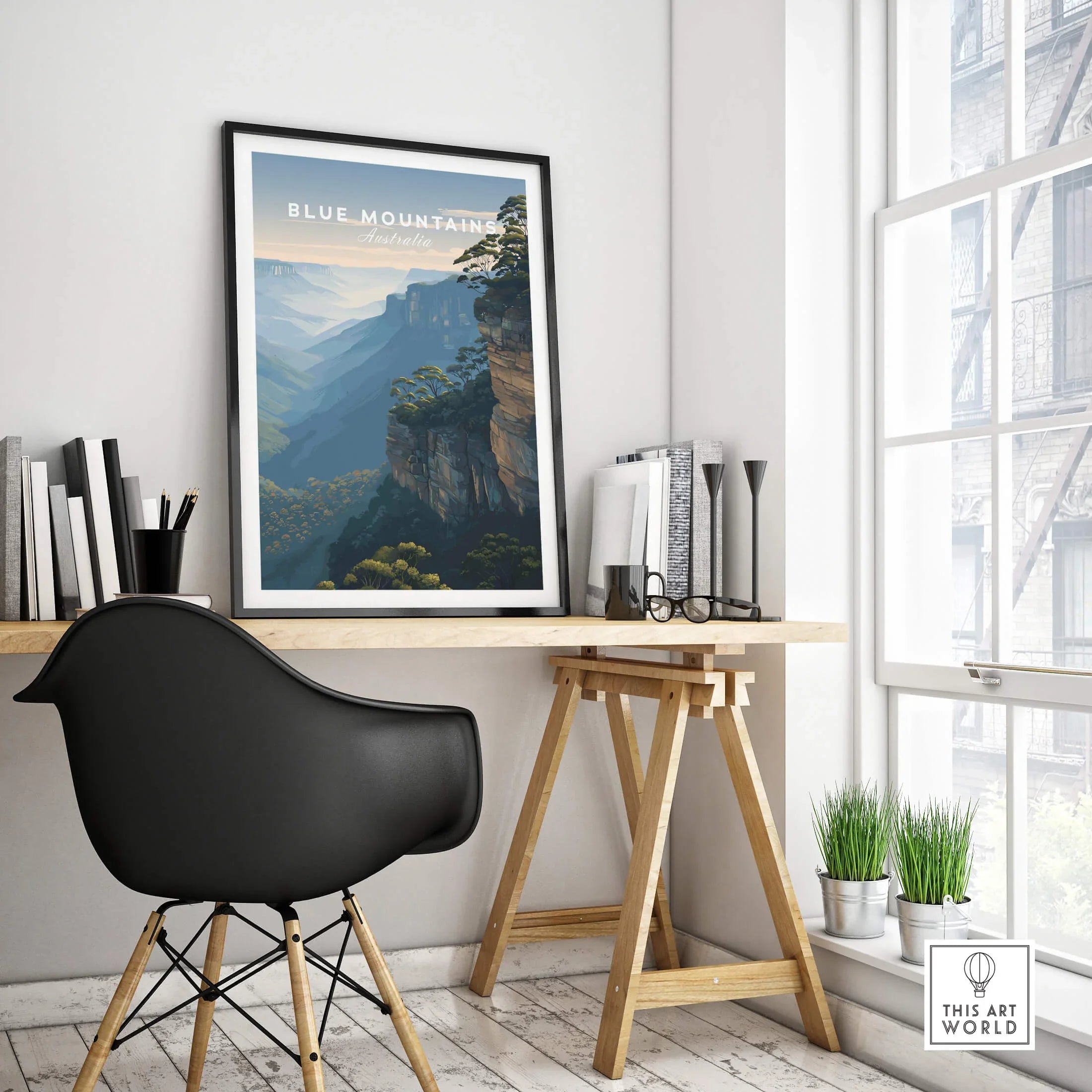 Framed Blue Mountains Australia travel poster on modern office desk with black chair