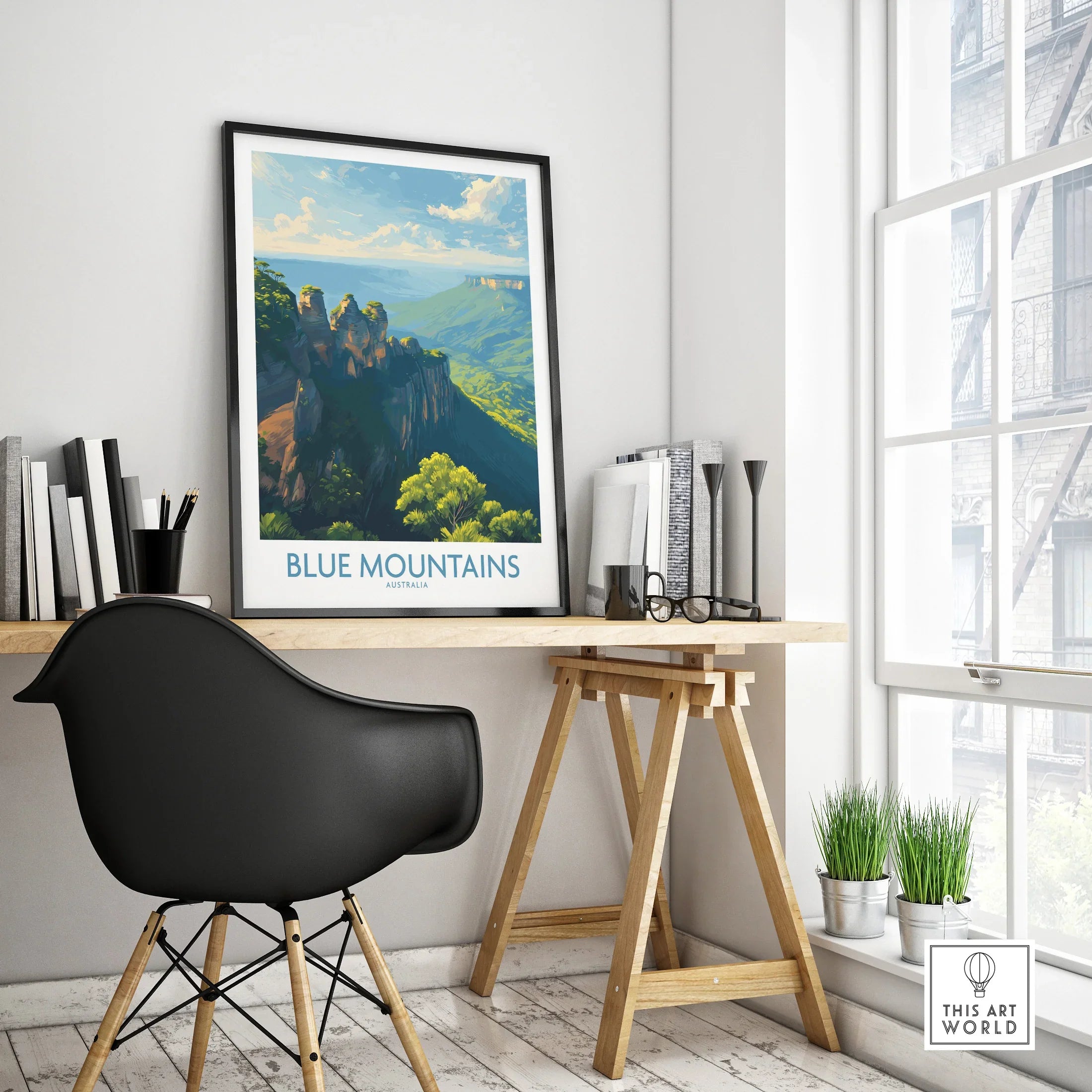 Framed Blue Mountains Australia travel poster on a modern office desk with natural light.